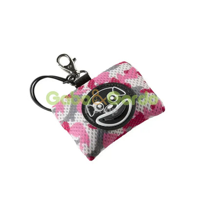 Dispensador TRE PONTI Smile Dog rosa camuflaje para bolsas de perro, silencioso y práctico.
