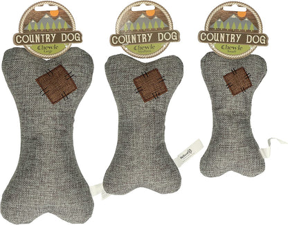 Perro jugando con el juguete de peluche Country Dog Chewie ecológico